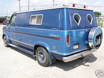 1978 Ford E150 - This van has custom pinstriping and a spare tire mounted on the rear.