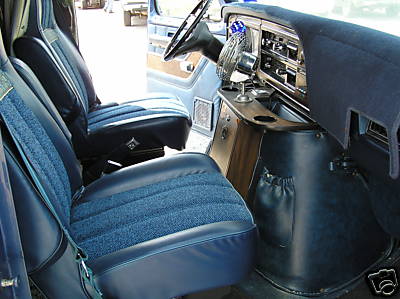 1978 Ford E150 - Interior view of a van, showing the driver and passenger seats, dashboard, and steering wheel.
