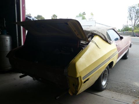 1975 Ford Ranchero - Rear view of a 1975 Ford Ranchero, trunk open, in a garage setting.