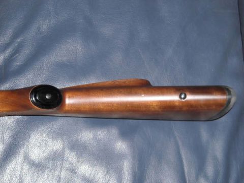 1991 Ford Bronco - A close-up view of a wooden gun stock, showing its smooth finish and hardware details.