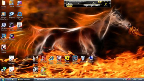 2000 Mercury Grand Marquis - A fiery horse graphic serves as a desktop background, complete with numerous program icons and a website URL at the bottom.
