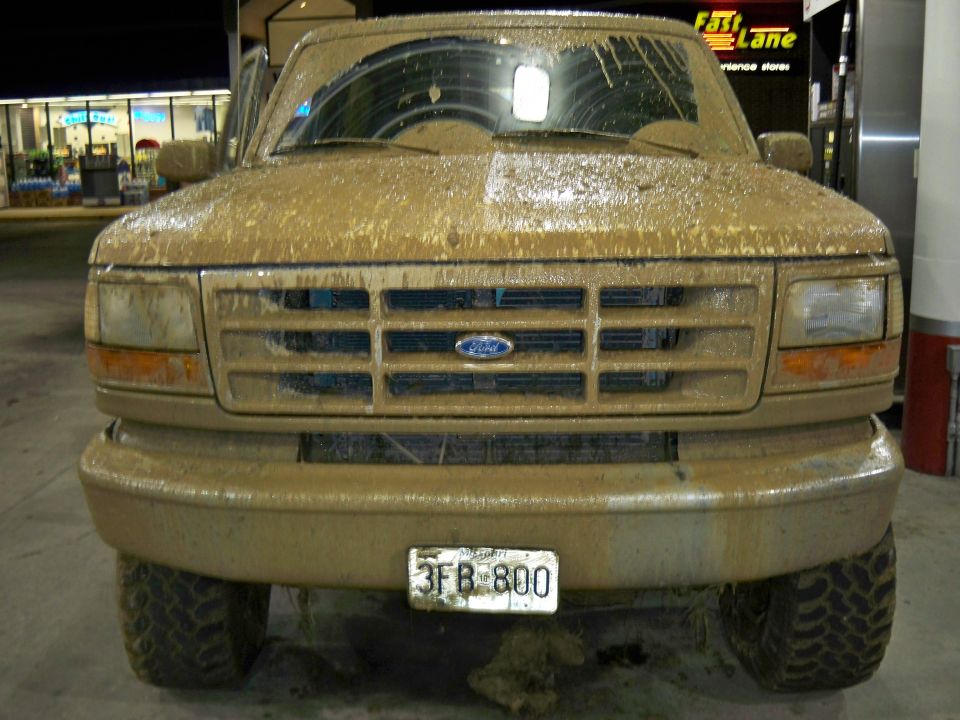 Mud-covered 1992 Ford F-Series truck front view, license plate 3FB 800 visible
