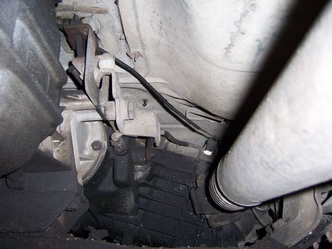 1991 Ford Bronco - Close-up of the vehicle's drivetrain components, including the transmission and driveshaft.
