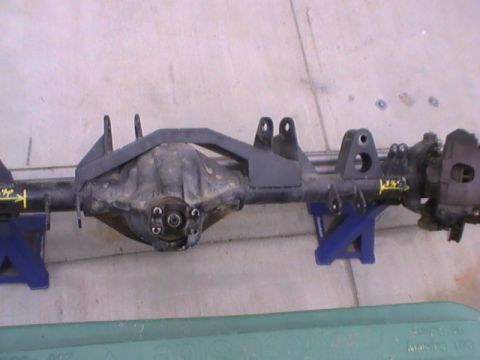 1997 Ford Ranger - Rear axle assembly supported by jack stands, with visible measurement markers.