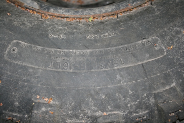 Tire sidewall showing 15/38-16LT size and "TUBELESS" text