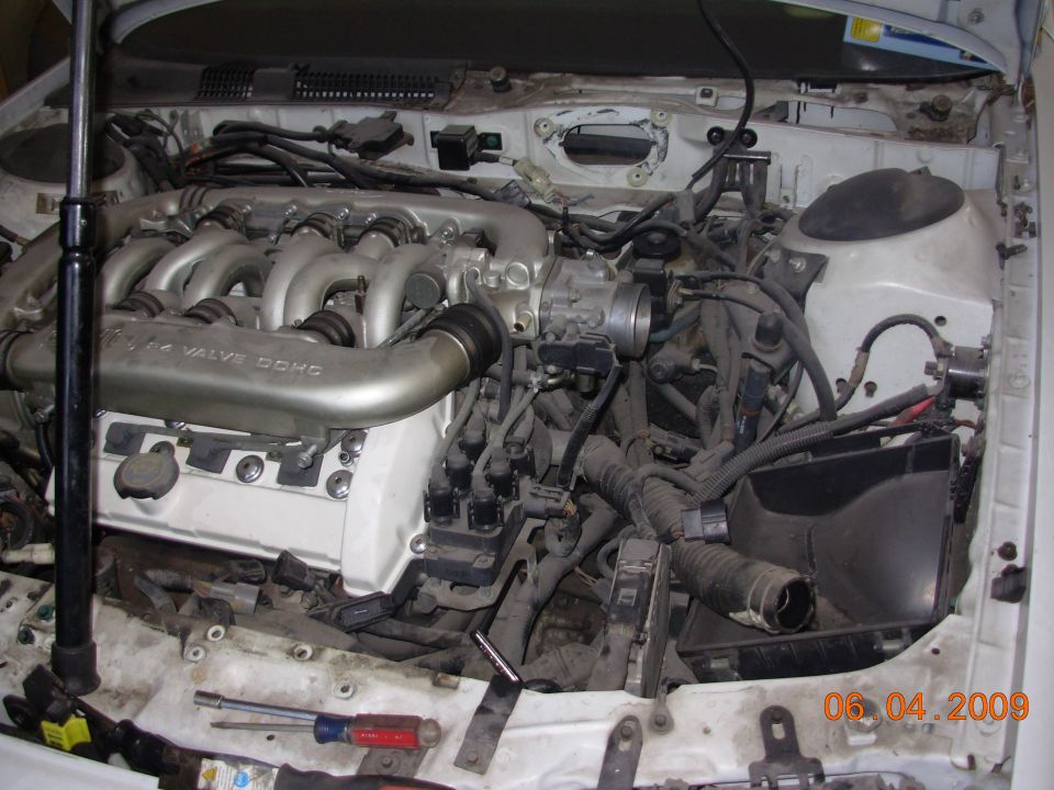 1995 Ford Taurus V6 engine bay, showing intake manifold and wiring