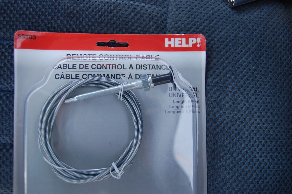 Remote control cable in plastic packaging with HELP! branding and multilingual text