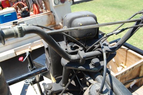1985 Ford Ranger - Close-up view of the engine and handlebars of an unidentified vintage vehicle.