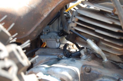 1985 Ford Ranger - Detail shot of a carburetor and engine block, likely from a motorcycle or similar engine.