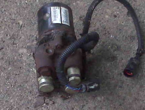 1995 Ford Bronco - This is an automotive part with visible labels and a connected wiring harness.