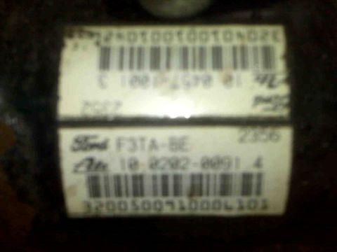 1995 Ford Bronco - A close-up of a Ford part label shows a barcode and identifying text, likely for a vehicle component.