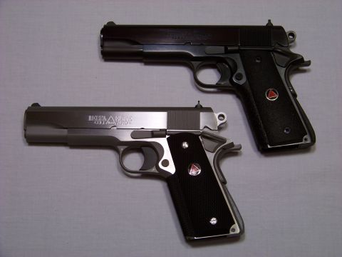1995 Mercury Grand Marquis - Two handguns are shown, one stainless steel and one blued, with black grips.