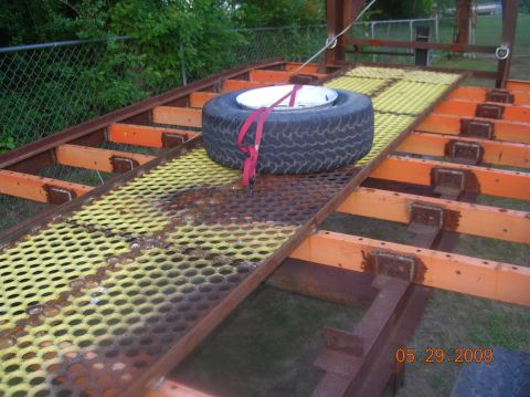 1991 Ford F-150 - A trailer deck shows a spare tire, with a date stamp and website visible in the corner.