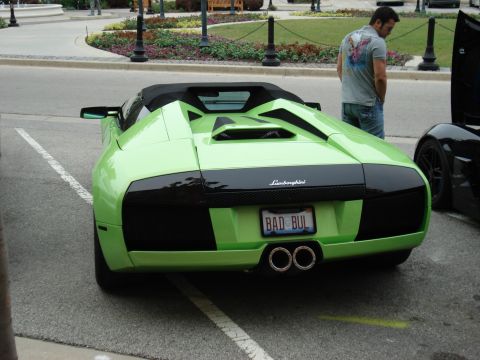 1998 Ford Taurus - A lime green Lamborghini convertible is parked at Cars and Coffee, a distinctive rear design and a personalized license plate.
