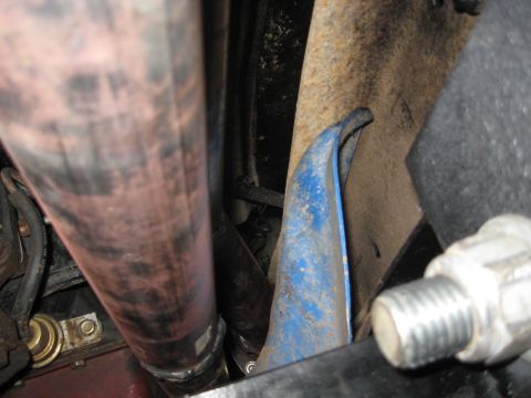 1978 Ford Bronco - Undercarriage view of a vehicle's exhaust and suspension system.