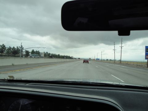 1990 Ford Taurus - Driving on a highway with a single red car in the distance.
