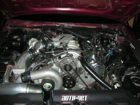1992 Ford Crown Victoria - Customized engine bay with twin turbochargers and visible intercooler piping.