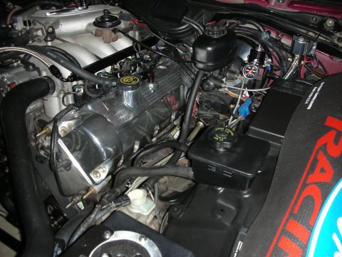 1992 Ford Crown Victoria - Close-up of an engine bay, focusing on the fuel system components and wiring.