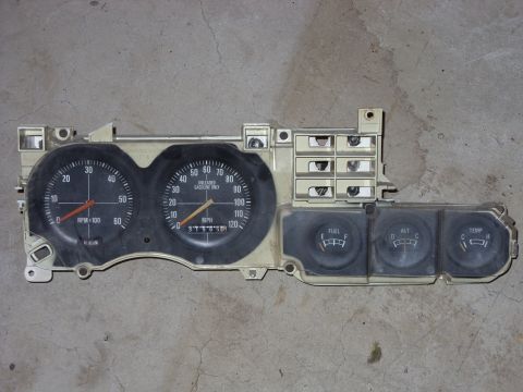 1988 Ford Bronco - Instrument cluster with gauges for fuel, alternator, and temperature.