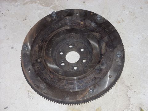 1988 Ford Bronco - This is a flywheel, a component of the powertrain, likely for a Ford vehicle given the registry information.