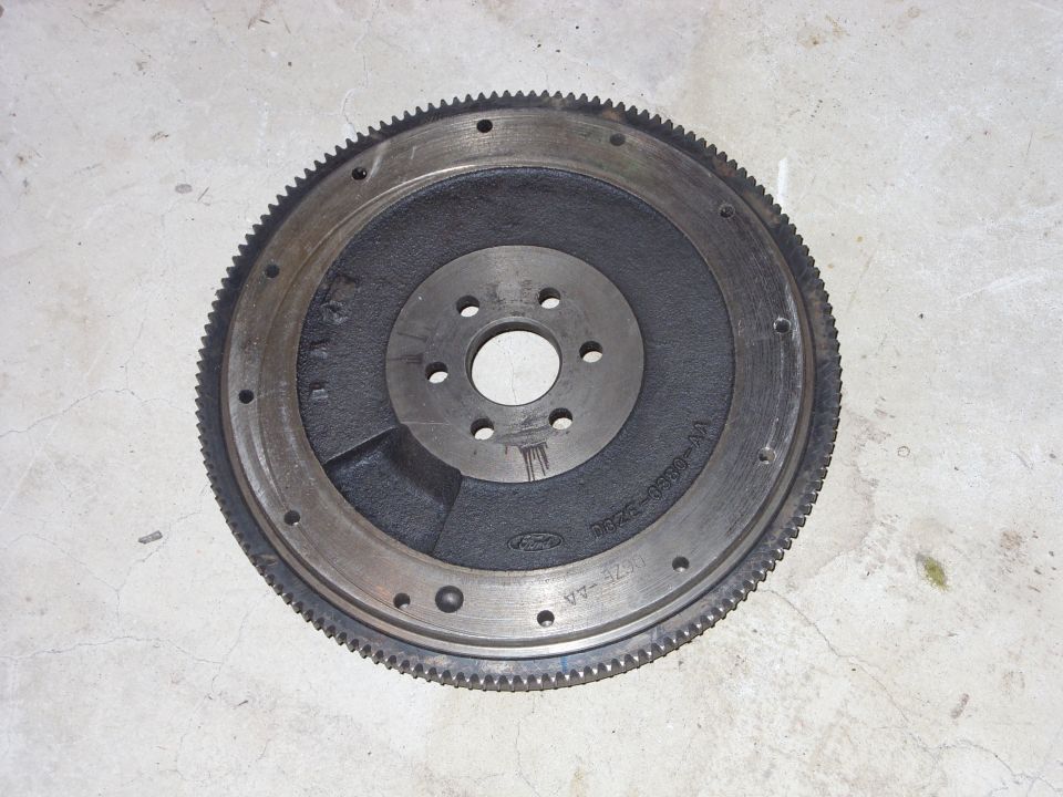 Ford flywheel with part number E2ZE-6380-BA visible