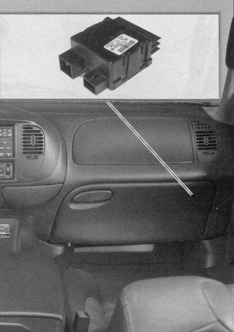 2007 Ford Mustang - Photograph of an electronic module mounted under the dashboard with an inset close-up of the part, not a classifiable technical document.