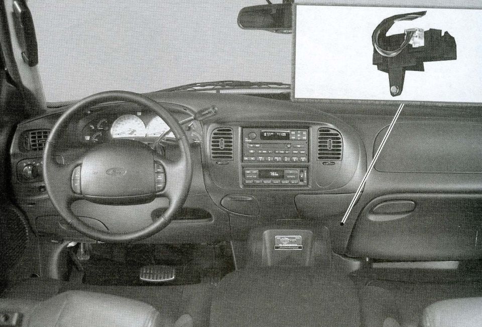 Annotated black-and-white Ford dashboard interior indicating the blend door actuator