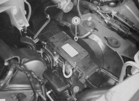 2007 Ford Mustang - This image shows a close-up view of the ABS module and associated brake lines within a vehicle's engine bay.