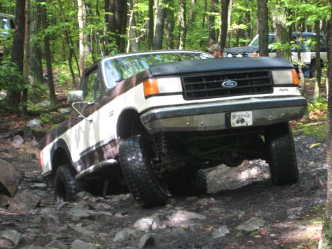 1991 Ford Bronco - This 1991 Ford Bronco is tackling a rocky off-road course in a wooded area.