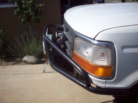 1995 Ford Bronco - Front view of a 1995 Ford Bronco showing its grille, headlights, and brush guard.