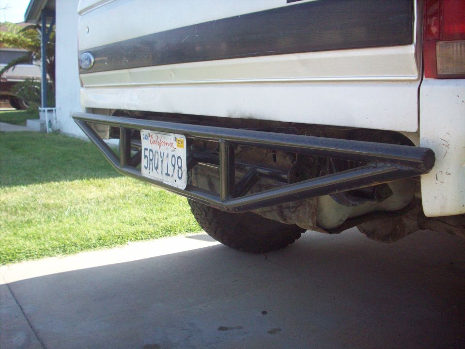 White Ford Bronco rear bumper with custom metal guard and California license plate 5RQY198