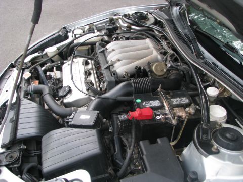 2001 Mitsubishi Eclipse - Engine bay of a 2001 Mitsubishi Eclipse, showing the V6 engine and associated components.