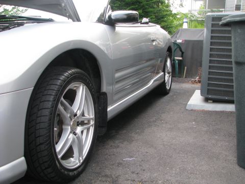 2001 Mitsubishi Eclipse - A silver 2001 Mitsubishi Eclipse convertible is shown from the side with its hood open, parked outdoors.
