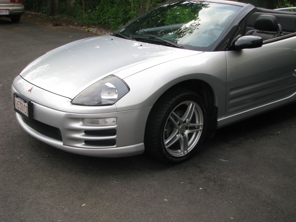 Silver Mitsubishi Eclipse Spyder convertible, top down, front three-quarter view