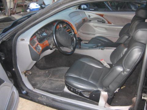 1996 Ford Thunderbird - Interior view of a 1996 Ford Thunderbird, highlighting the seats and dashboard.
