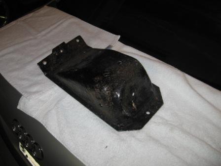 1993 Ford Bronco - Metal bracket shown on a towel, likely a car part for sale.