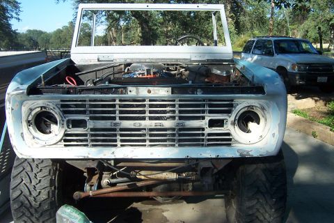 1976 Ford Bronco - This 1976 Ford Bronco is undergoing some work, with its front end and engine exposed.
