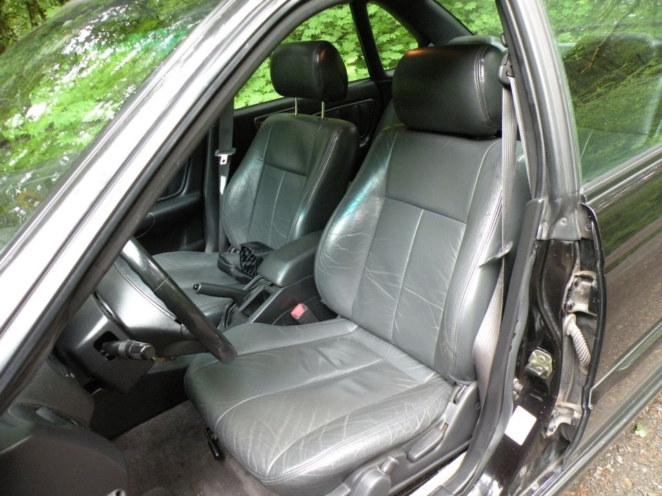 Interior view of gray leather seats and dashboard