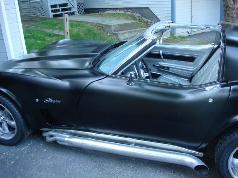 1975 Chevrolet Corvette - This Stingray has a matte black finish and prominent side exhaust pipes.