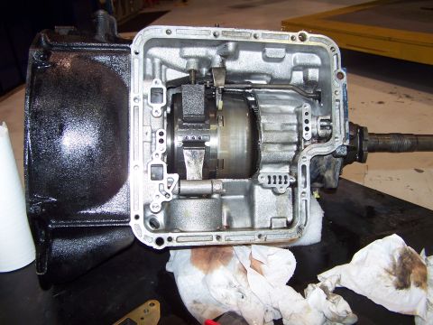1973 Ford Ranchero - valve body has been removed and the tail housing has been removed; thats the intermediate band and the fwd clutch hub.