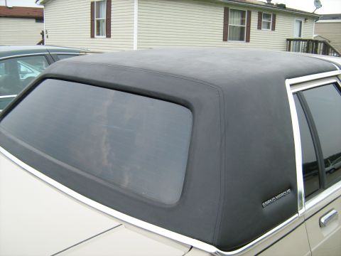 1988 Mercury Grand Marquis - The vinyl top and 'Grand Marquis' badge confirm this is a 1988 Mercury Grand Marquis.