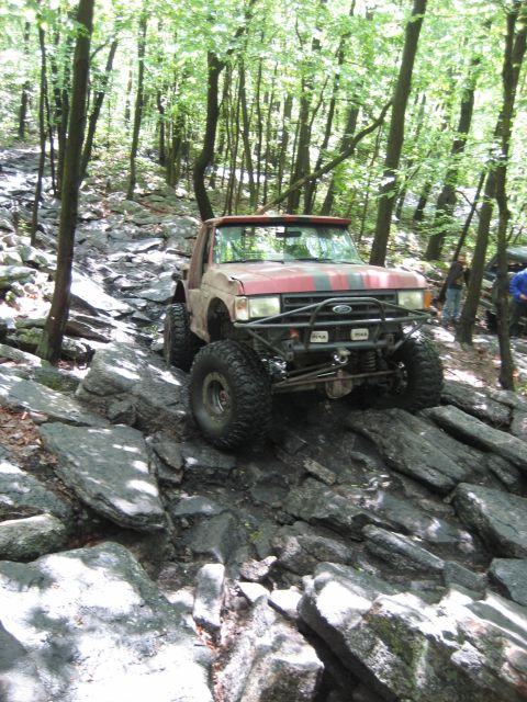 1991 Ford Bronco - This 1991 Ford Bronco navigates a challenging rocky terrain during an off-road event.