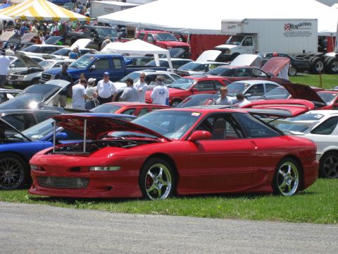 1994 Ford Probe - A red 1993 Ford Probe is displayed with its hood open at an outdoor car event.