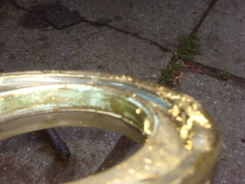 1995 Ford Bronco - A close-up view of a corroded metal axle component, possibly from a truck, with a website watermark visible.