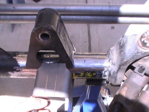 1997 Ford Ranger - A close-up view of a vehicle's suspension component, possibly undergoing modification or repair.