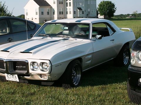 1970 Ford Mustang - This classic Pontiac Firebird Trans Am features distinctive racing stripes and a sporty spoiler.