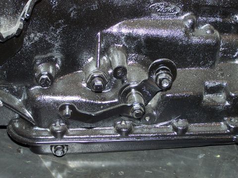 1973 Ford Ranchero - this is the shift linkage and kick-down lever. the square bolt and jamb nut is the intermediate band adjustment screw. I installed a B&M dr…