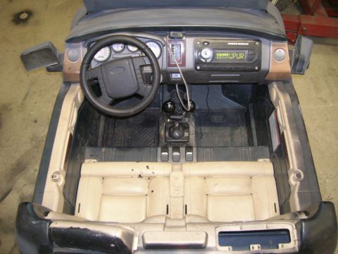 1996 Ford Bronco - Interior view of a toy vehicle, showing the dashboard, steering wheel, and seats.