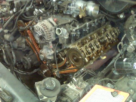 2001 Ford Crown Victoria - Close-up view of a vehicle's engine compartment with internal components exposed for maintenance.