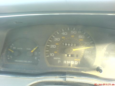 1992 Ford Crown Victoria - The dashboard gauges display the mileage at 19,820 and the fuel level, indicating the interior view of the vehicle.
